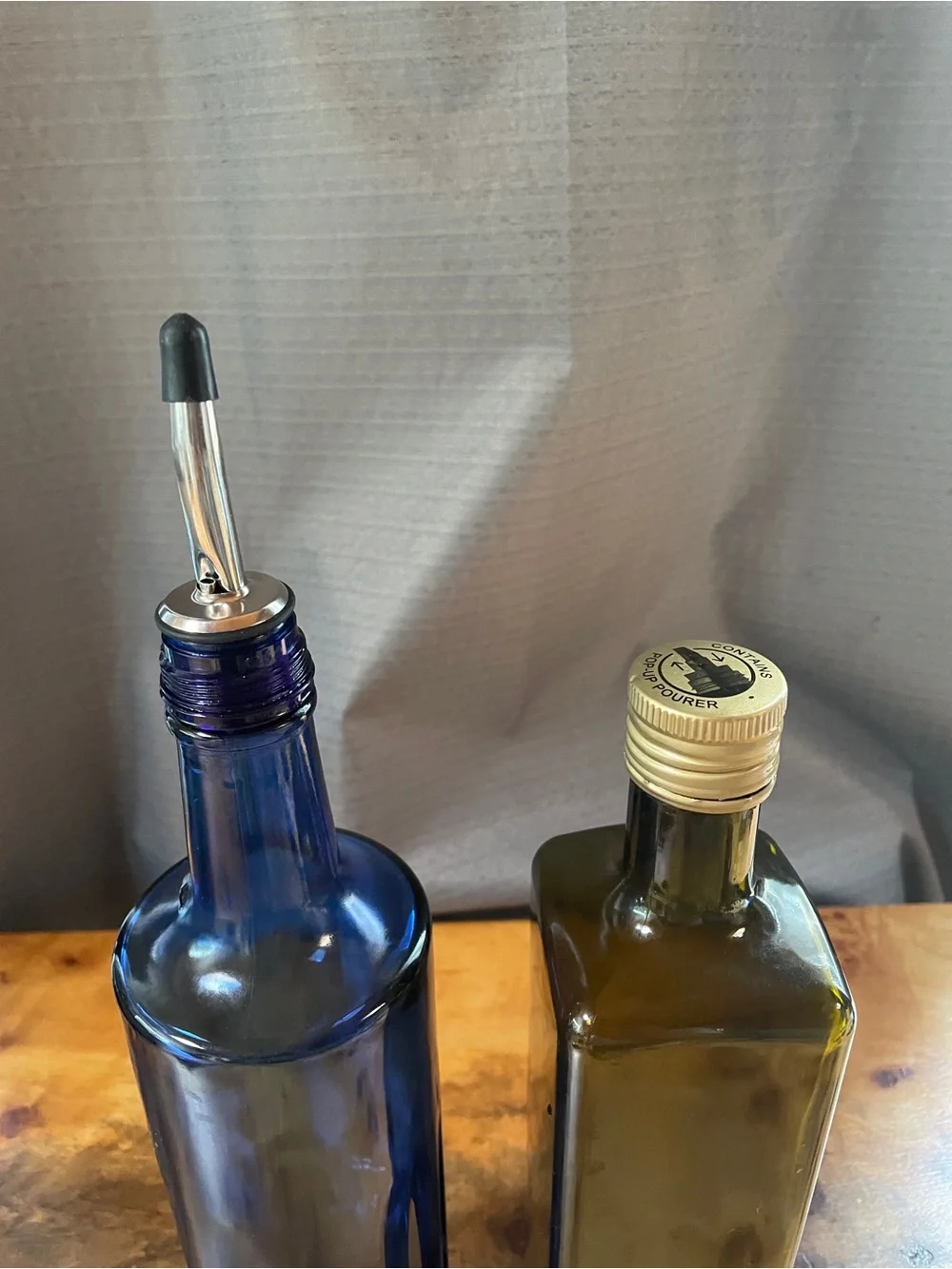 Two pour spout bottles